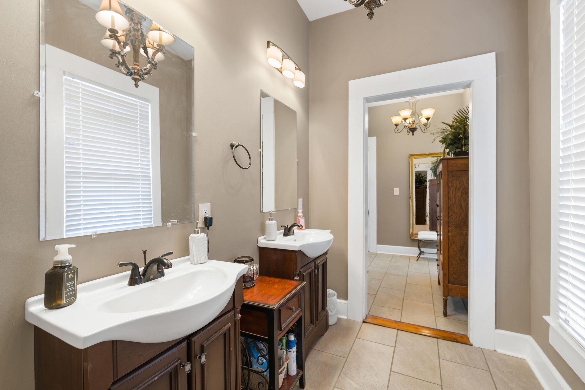 554 East Main Street Jackson, TN 38301 - Photo 30 of 38 a bathroom with a sink double vanity and a mirror