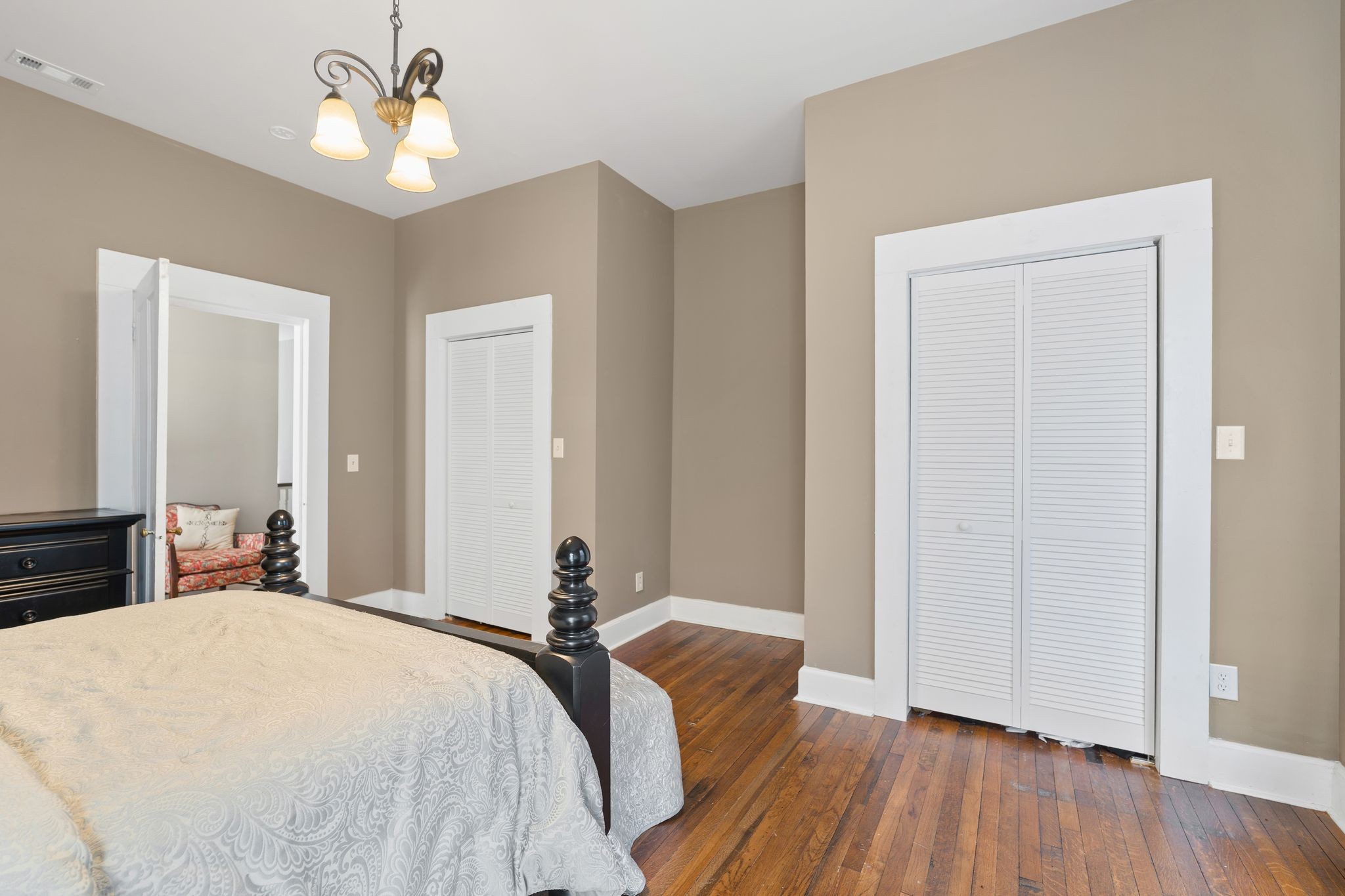 554 East Main Street Jackson, TN 38301 - Photo 34 of 38 a bedroom with a bed and wooden floor