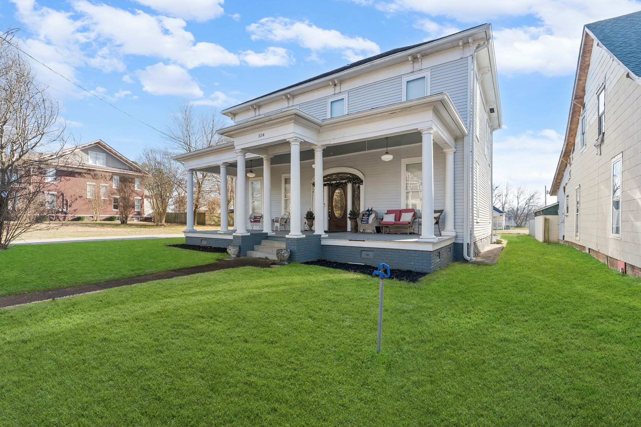 554 East Main Street Jackson, TN 38301 - Photo 5 of 38 a view of a house with a big yard and large tree
