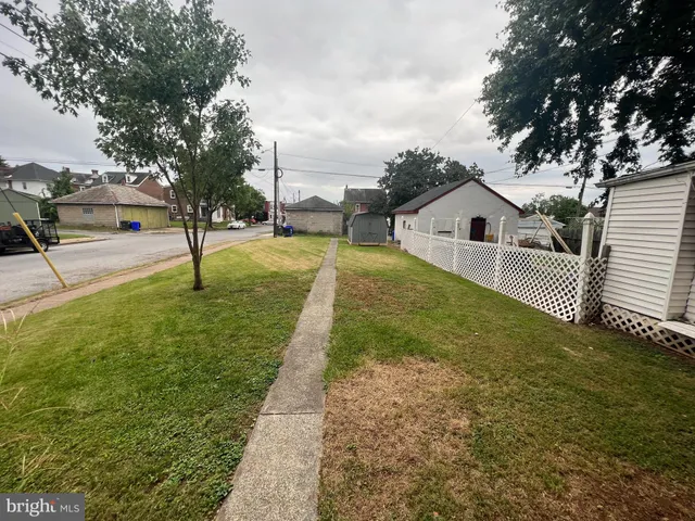 a view of a backyard of the house
