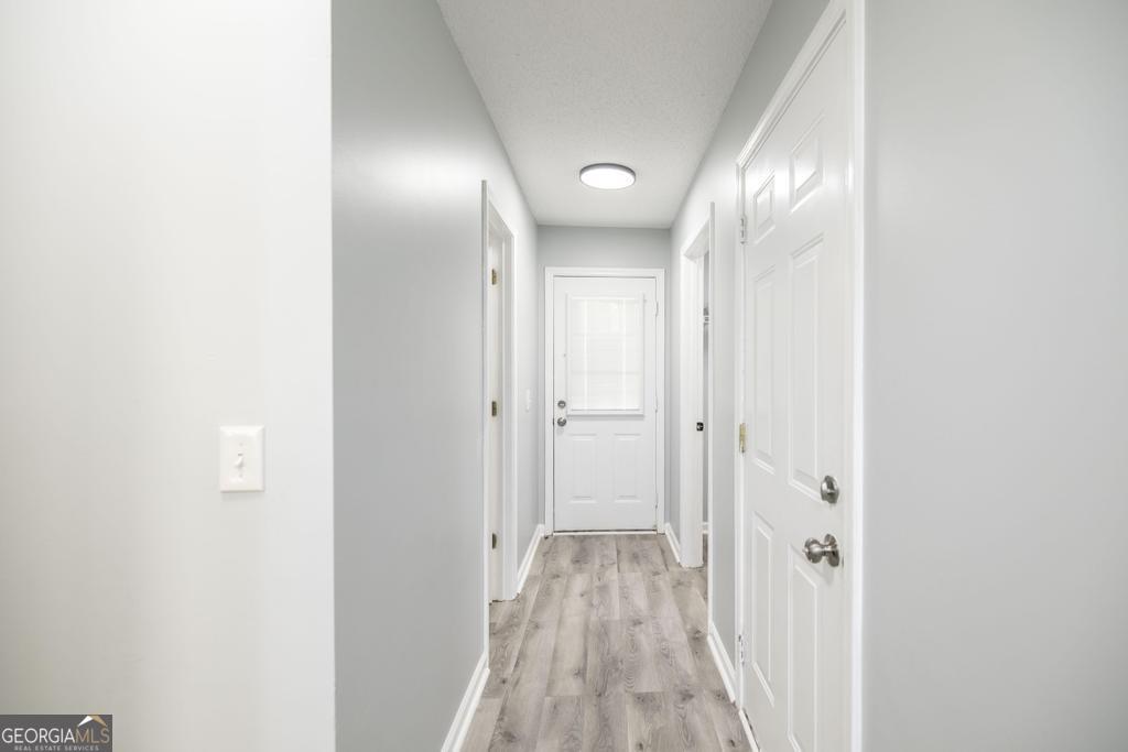 105 Browning Point Byron, GA 31008 - Photo 28 of 39 a view of a hallway with wooden floor