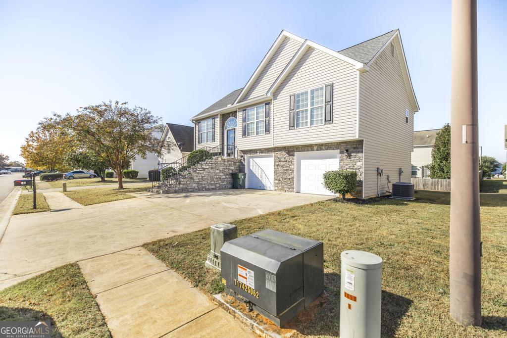 105 Browning Point Byron, GA 31008 - Photo 3 of 39 a view of a white house with a swimming pool