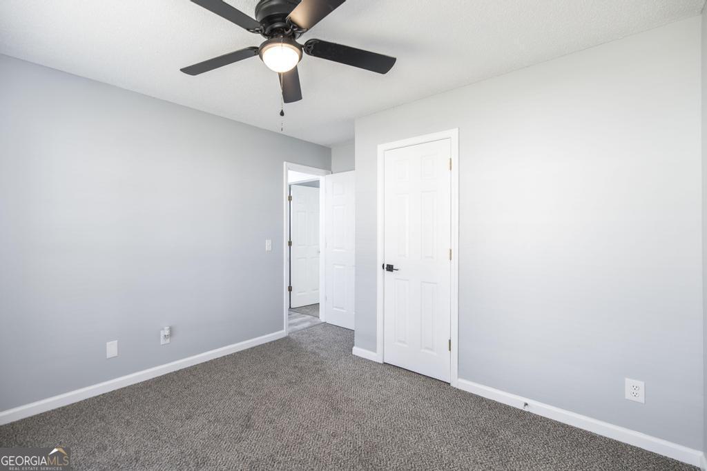 105 Browning Point Byron, GA 31008 - Photo 32 of 39 an empty room with chandelier fan