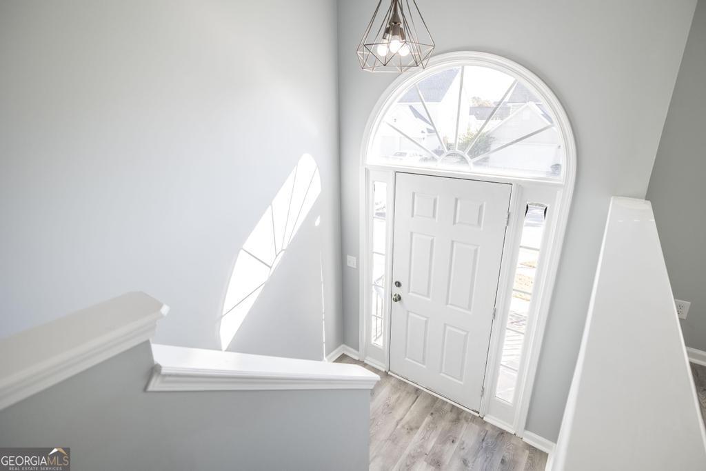 105 Browning Point Byron, GA 31008 - Photo 7 of 39 a view of empty room with wooden floor and fan