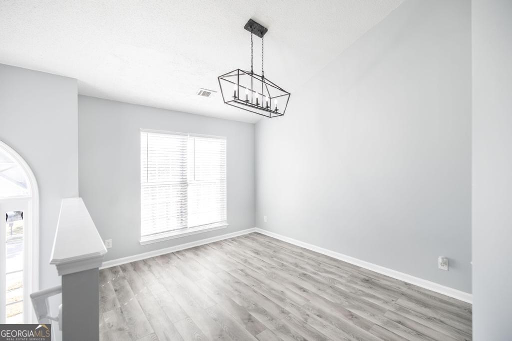 105 Browning Point Byron, GA 31008 - Photo 8 of 39 a view of empty room with wooden floor and fan