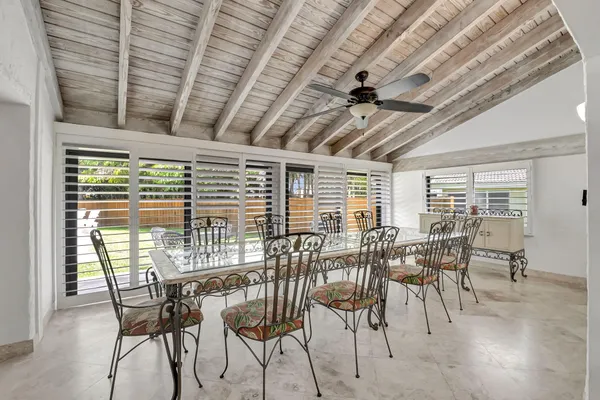 a view of a dining room with furniture window and outside view