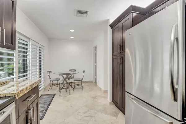 a view of a dining room with furniture window and outside view