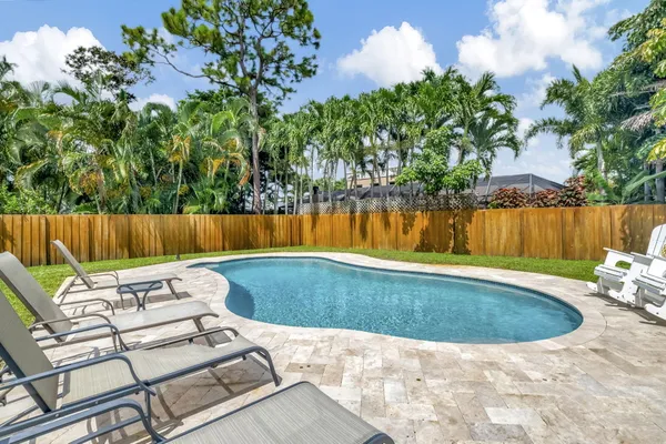 a view of a swimming pool with a patio