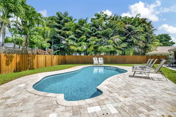 a view of a swimming pool with a patio