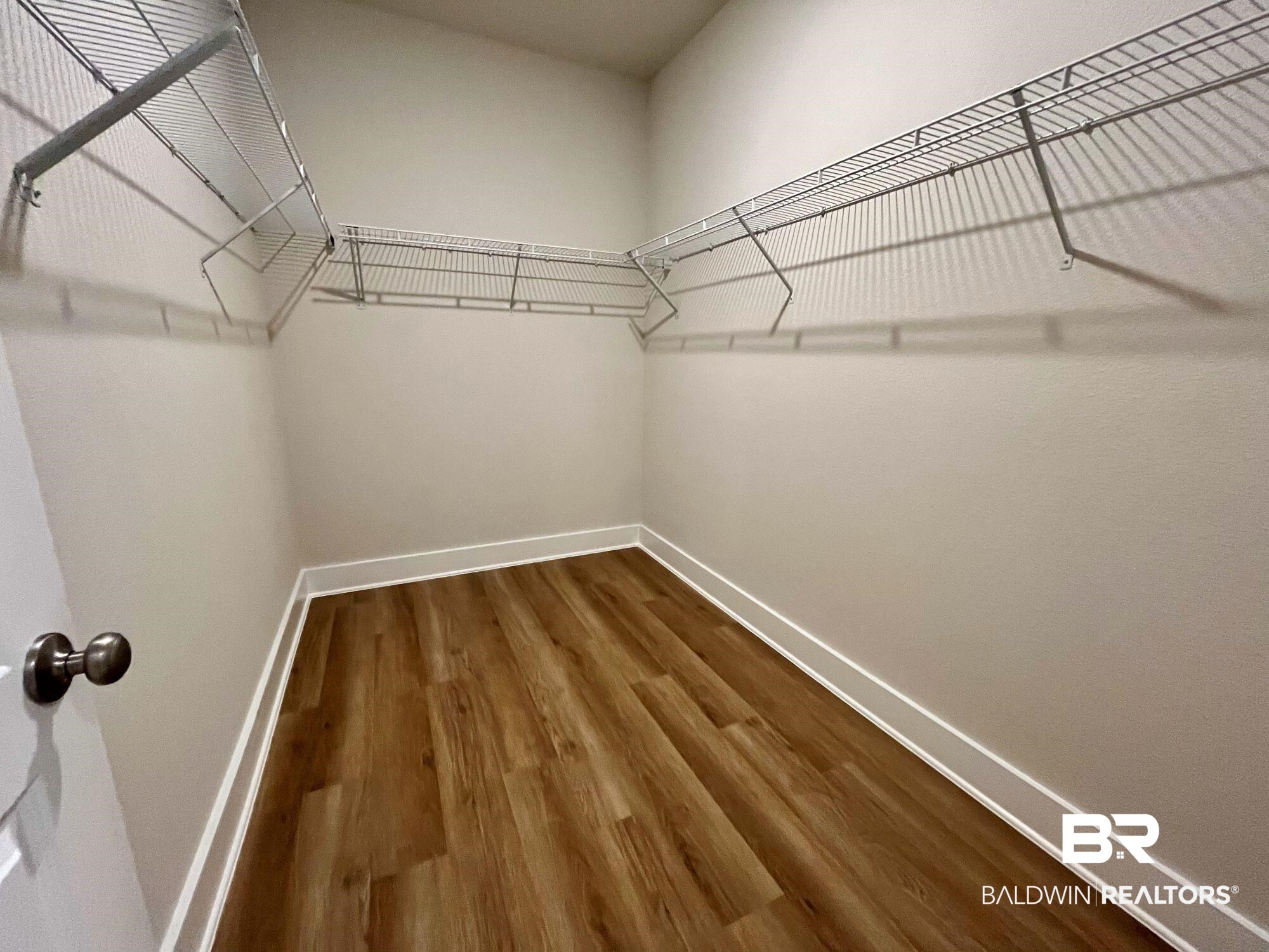 330 Barndling Street Fairhope, AL 36532 - Photo 25 of 31 Walk in closet with hardwood / wood-style flooring