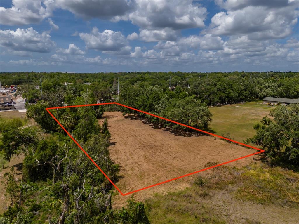 5106 Bell Shoals Road Valrico, FL 33596 - Photo 6 of 18 a view of a yard with a lake