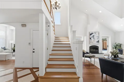 a view of entryway livingroom and hall with wooden floor