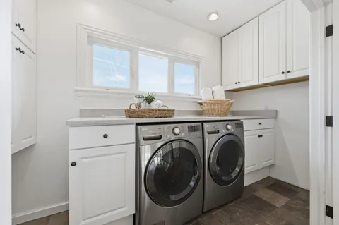 a utility room with closet dryer and washer