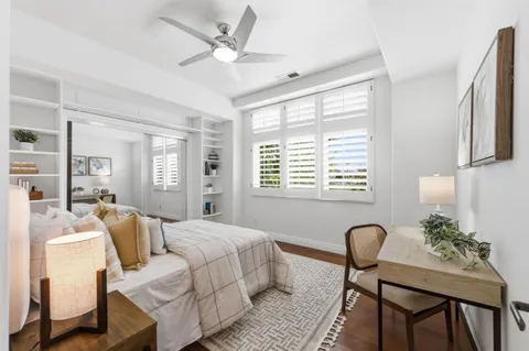 a bedroom with furniture and a window