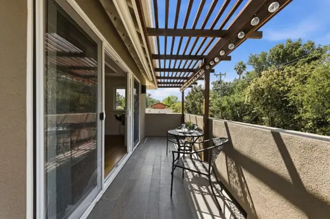 a view of balcony with furniture