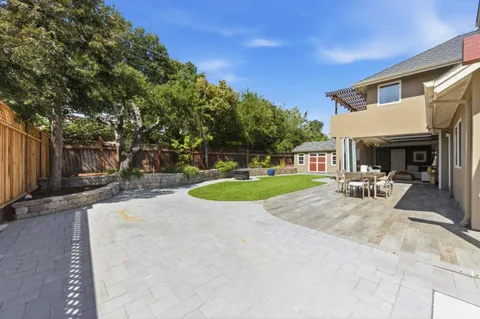 a view of a backyard with a patio