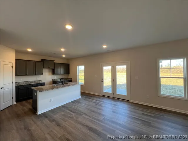 a kitchen with a stove top oven and sink