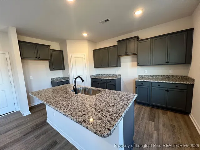 a kitchen with sink cabinets and outdoor view