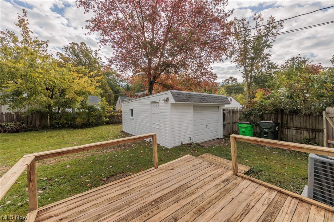 355 Dellwood Road Avon Lake, OH 44012 - Photo 33 of 35 Deck with a storage unit, a lawn, and central AC unit
