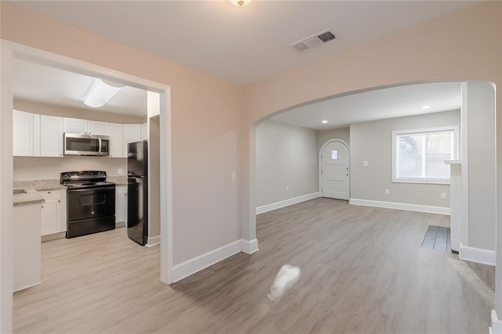 1376 Westmont Road Southwest Atlanta, GA 30311 - Photo 12 of 41 a view of a kitchen cabinets and wooden floor