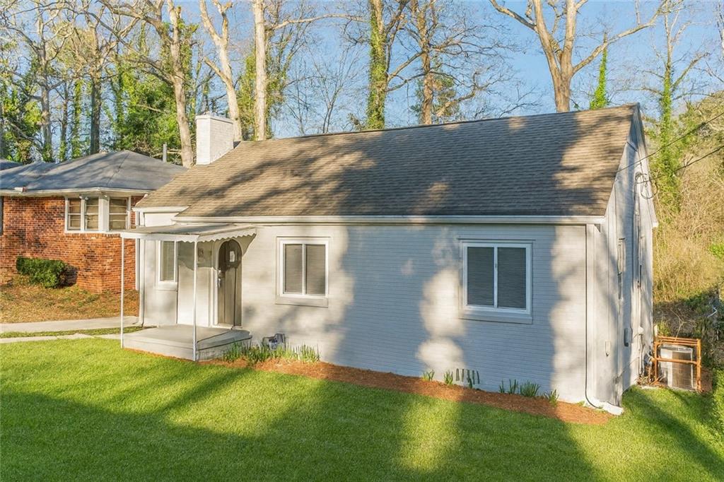 1376 Westmont Road Southwest Atlanta, GA 30311 - Photo 2 of 41 a view of a house with a yard