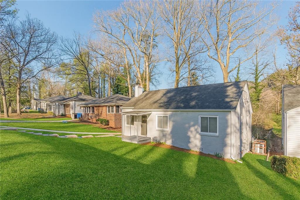 1376 Westmont Road Southwest Atlanta, GA 30311 - Photo 3 of 41 a front view of a house with a garden