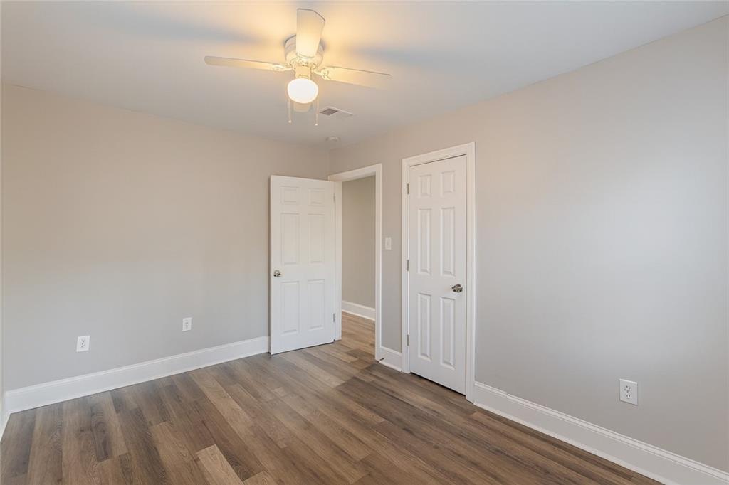 1376 Westmont Road Southwest Atlanta, GA 30311 - Photo 34 of 41 wooden floor in an empty room with a window