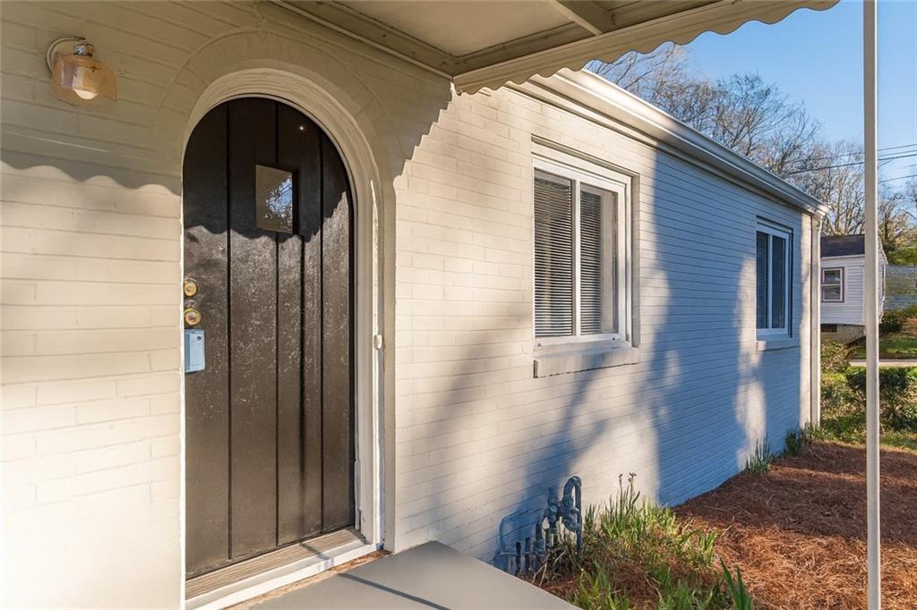 1376 Westmont Road Southwest Atlanta, GA 30311 - Photo 4 of 41 a front view of a house with garden