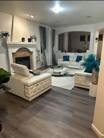 a living room with furniture and a fireplace