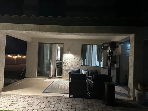 a living room with a couch and a rug