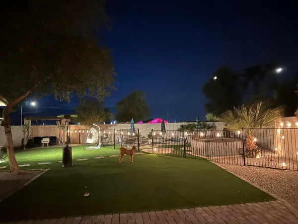 a view of a yard with table and chairs