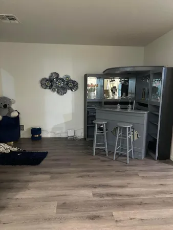 a room with furniture and a flat screen tv