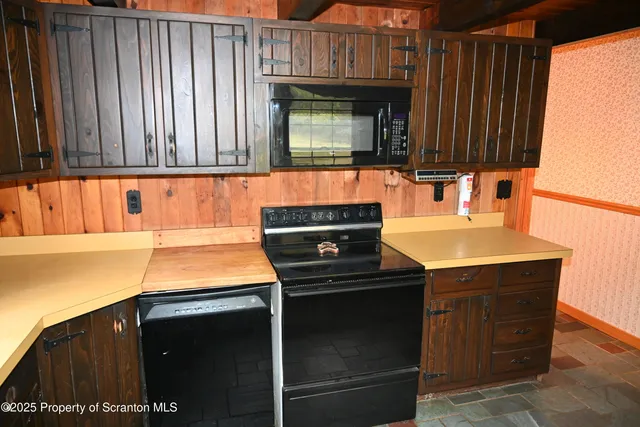 a kitchen with a sink and a microwave