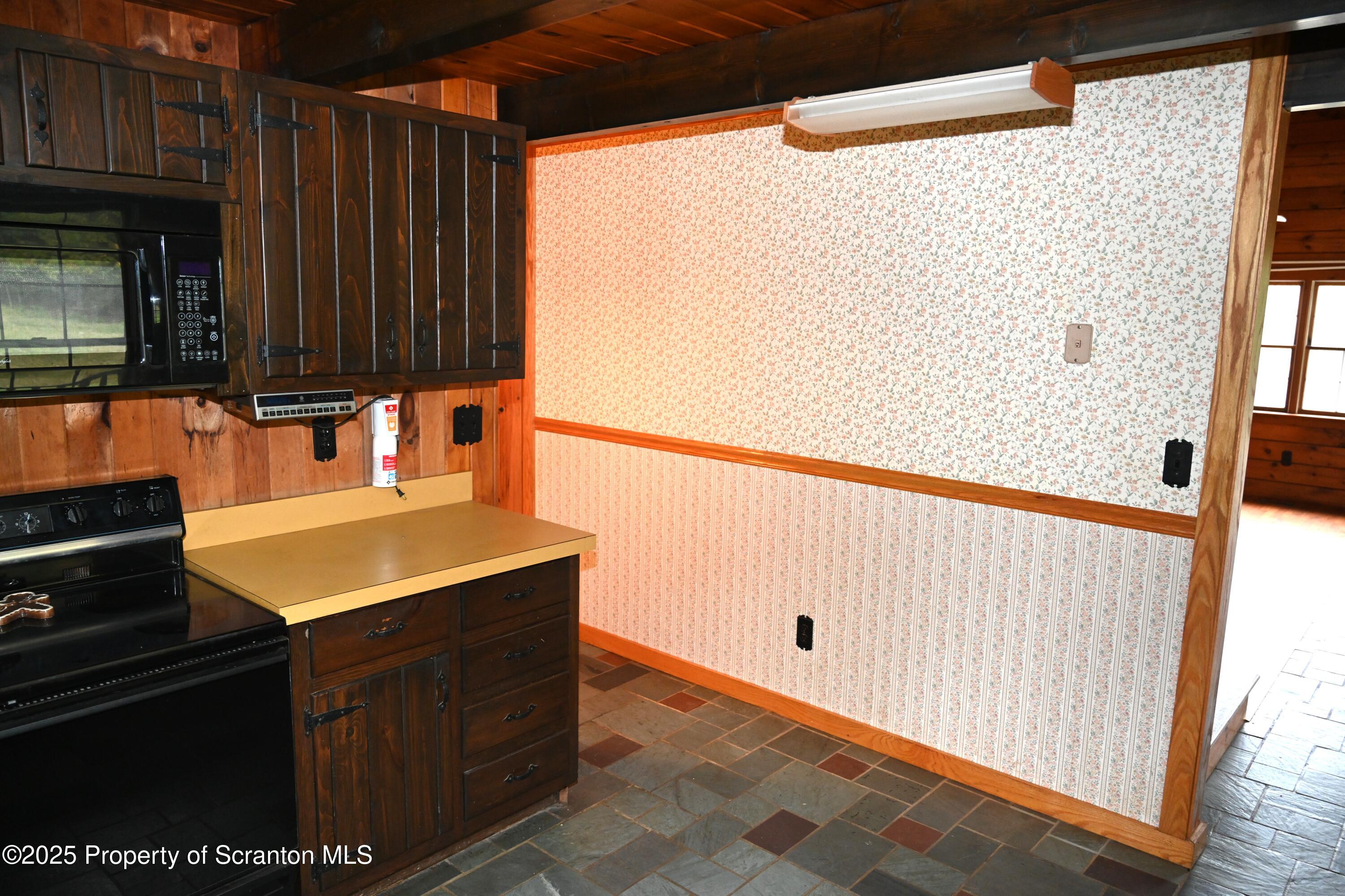 1271 Graham Holw Road Hallstead, PA 18822 - Photo 13 of 56 a kitchen with a sink and a refrigerator