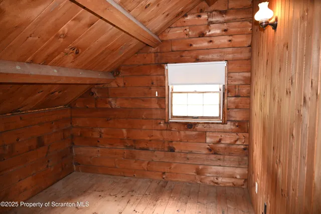 a view of a living room hardwood flooring and kitchen