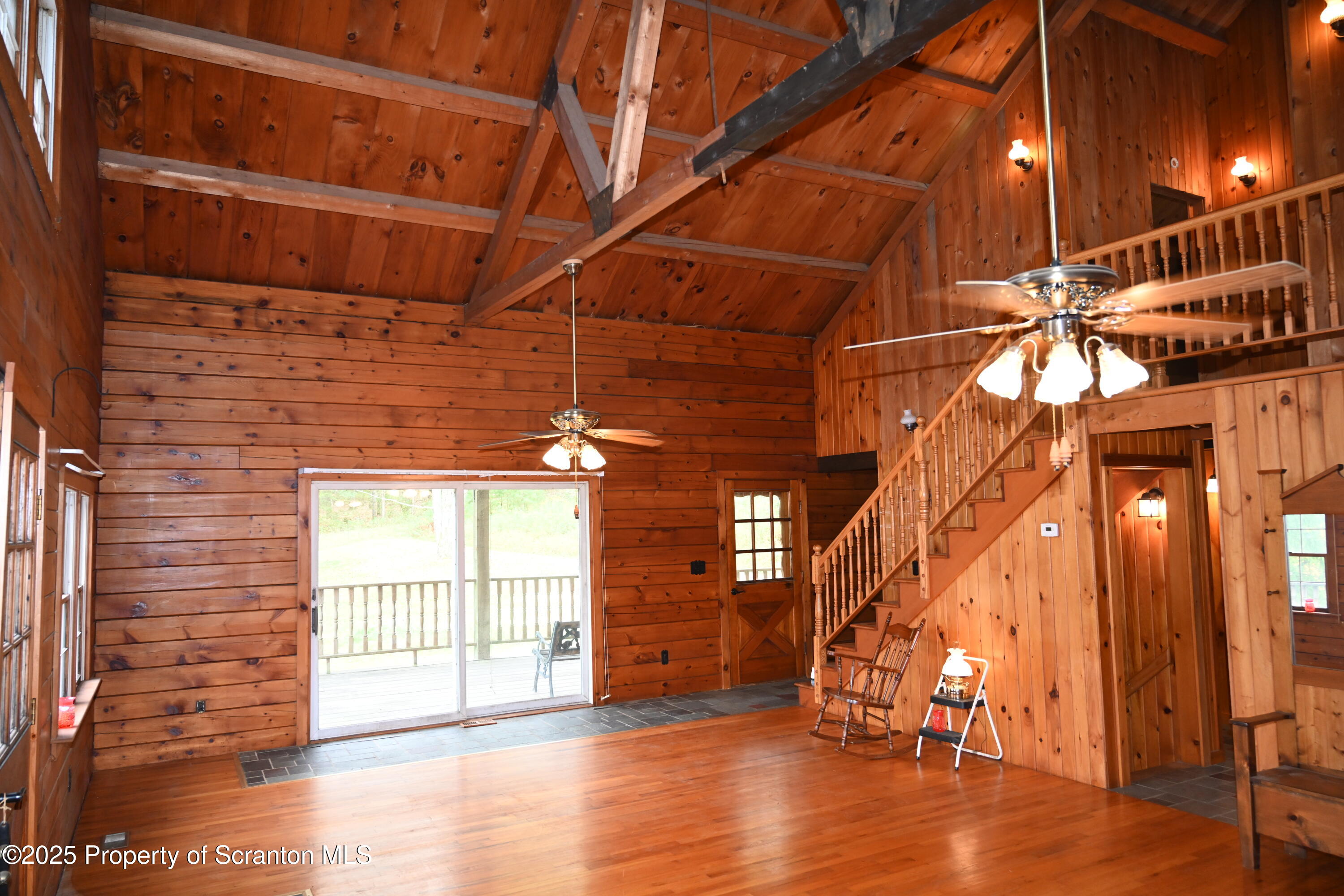 1271 Graham Holw Road Hallstead, PA 18822 - Photo 3 of 56 a view of an empty room with wooden floor and a window