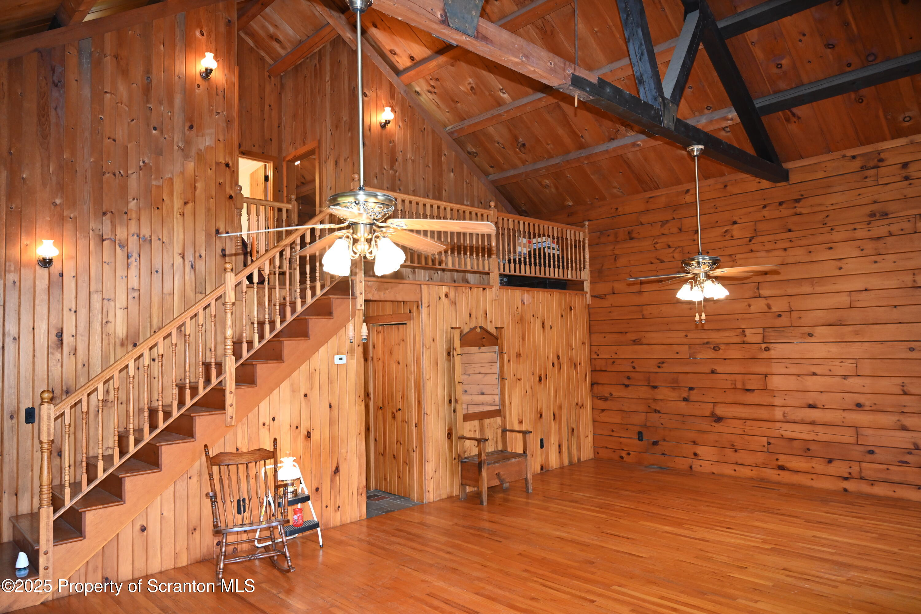 1271 Graham Holw Road Hallstead, PA 18822 - Photo 4 of 56 a view of a room with wooden floor and staircase