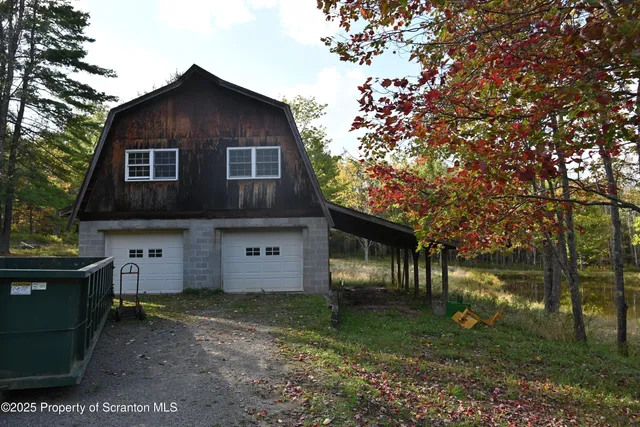 a backyard of a house with lots of green space and fountain