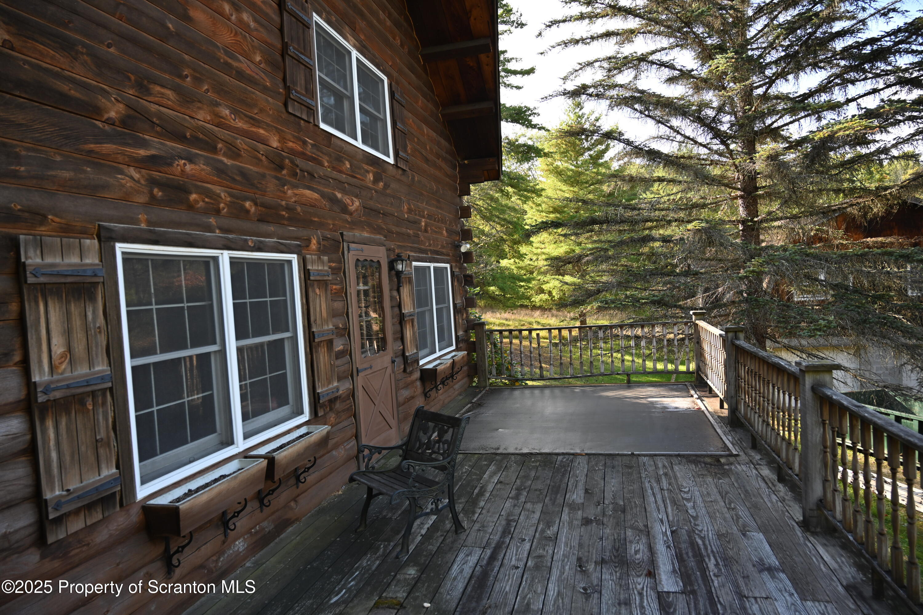 1271 Graham Holw Road Hallstead, PA 18822 - Photo 53 of 56 a view of a wooden balcony with a bench