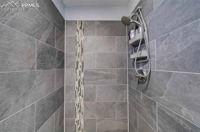 a living room with furniture a couch and a window