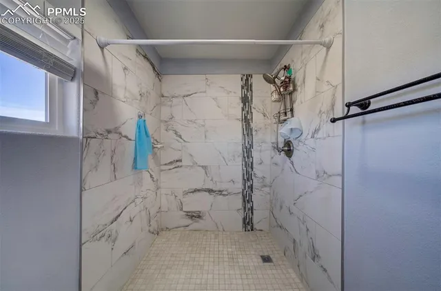 a kitchen with a sink and a refrigerator