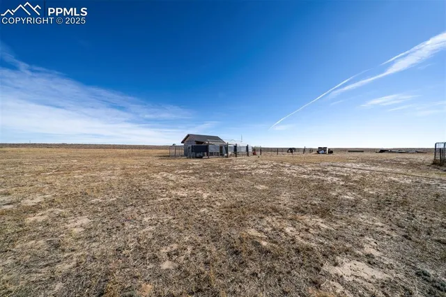 a view of a large building with a field