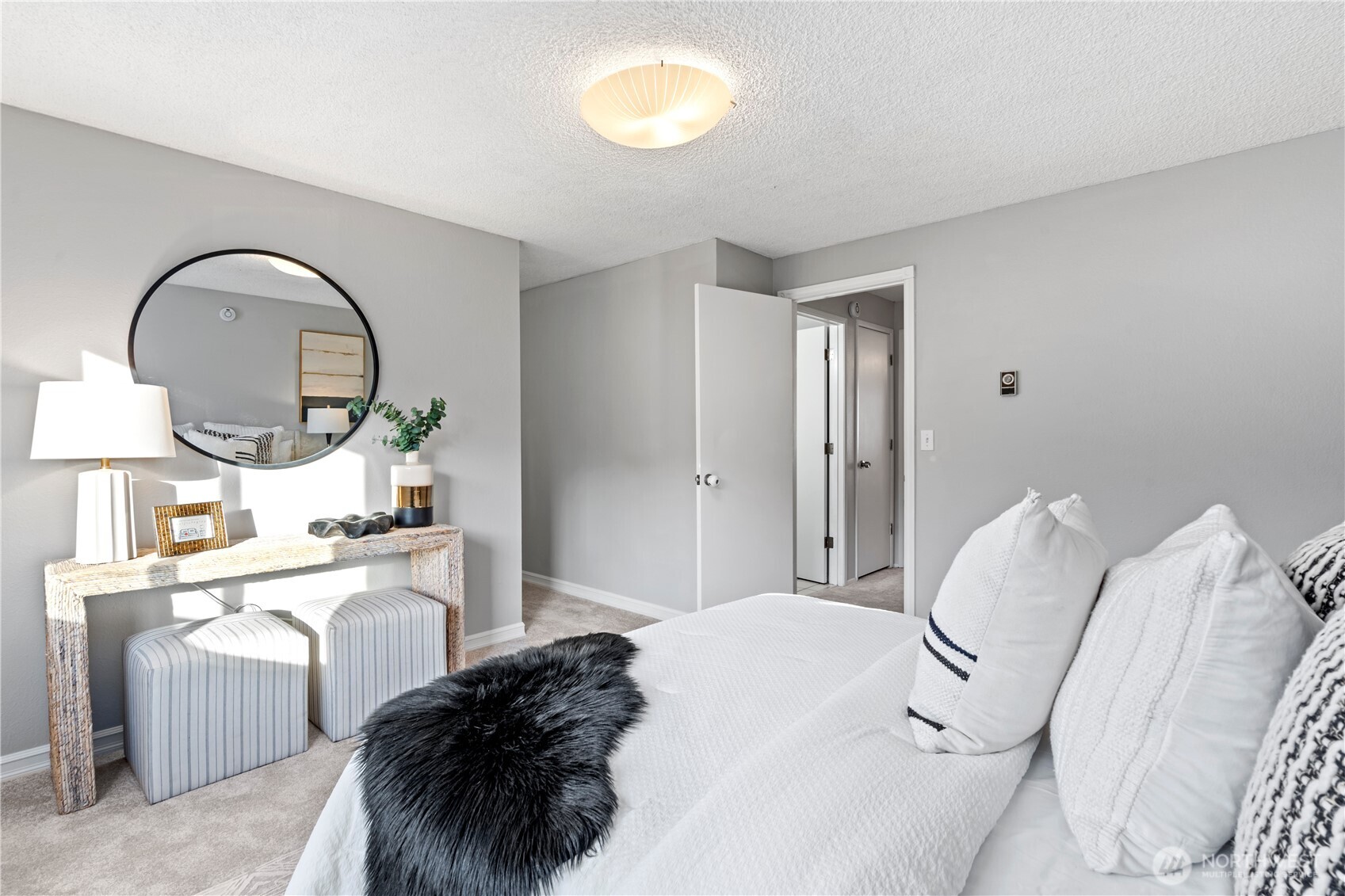 31921 46th Avenue Southwest Federal Way, WA 98023 - Photo 18 of 28 a room with a bed a mirror and a window