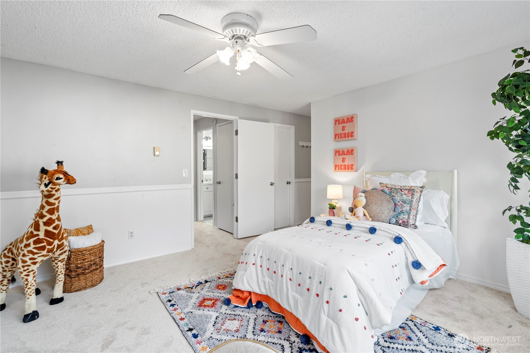 31921 46th Avenue Southwest Federal Way, WA 98023 - Photo 22 of 28 a bedroom with a bed and a chandelier
