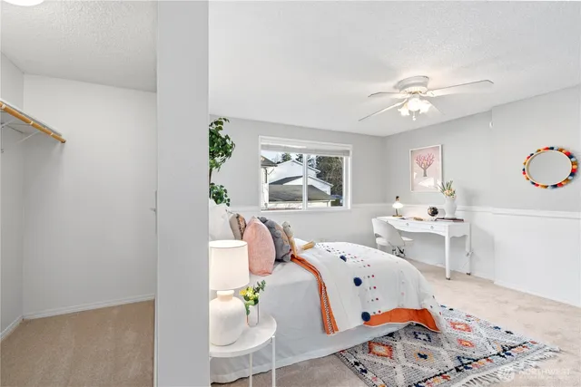 a bed room with two beds and a window