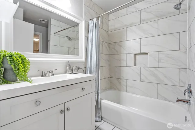 a bathroom with a bathtub and a sink
