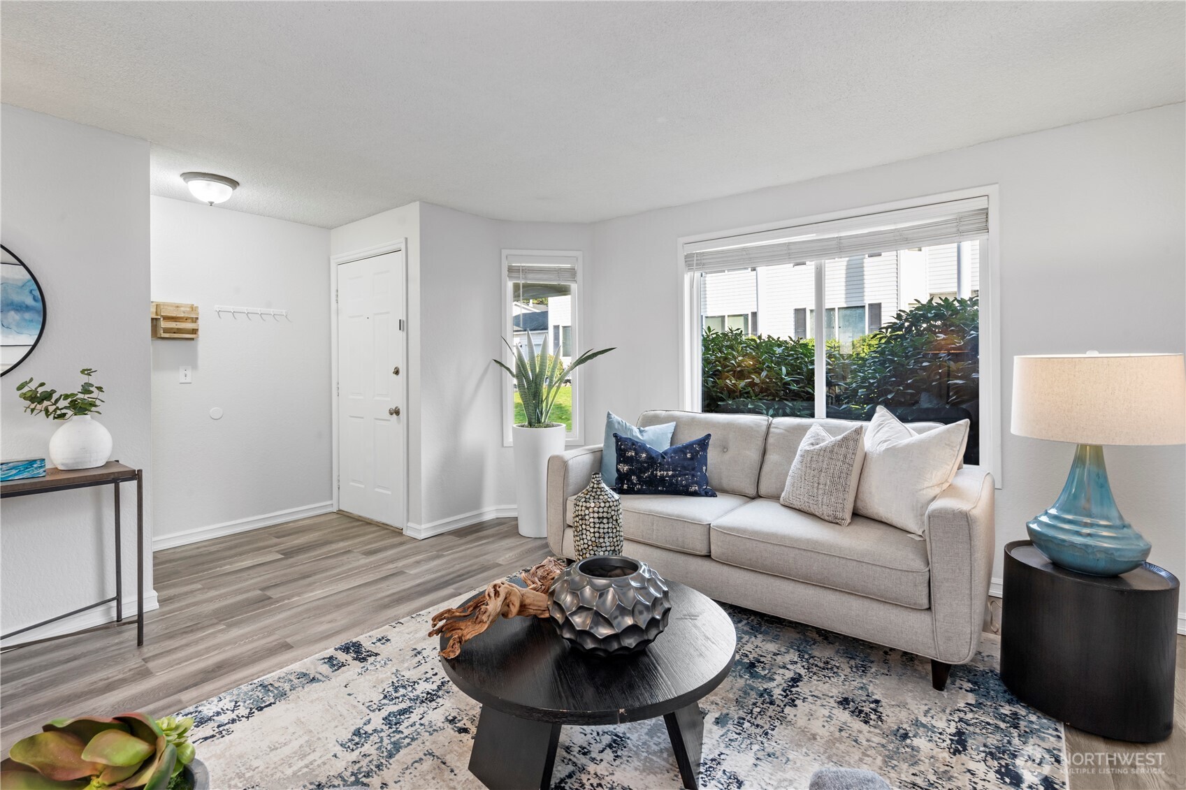 31921 46th Avenue Southwest Federal Way, WA 98023 - Photo 6 of 28 a living room with furniture and a potted plant