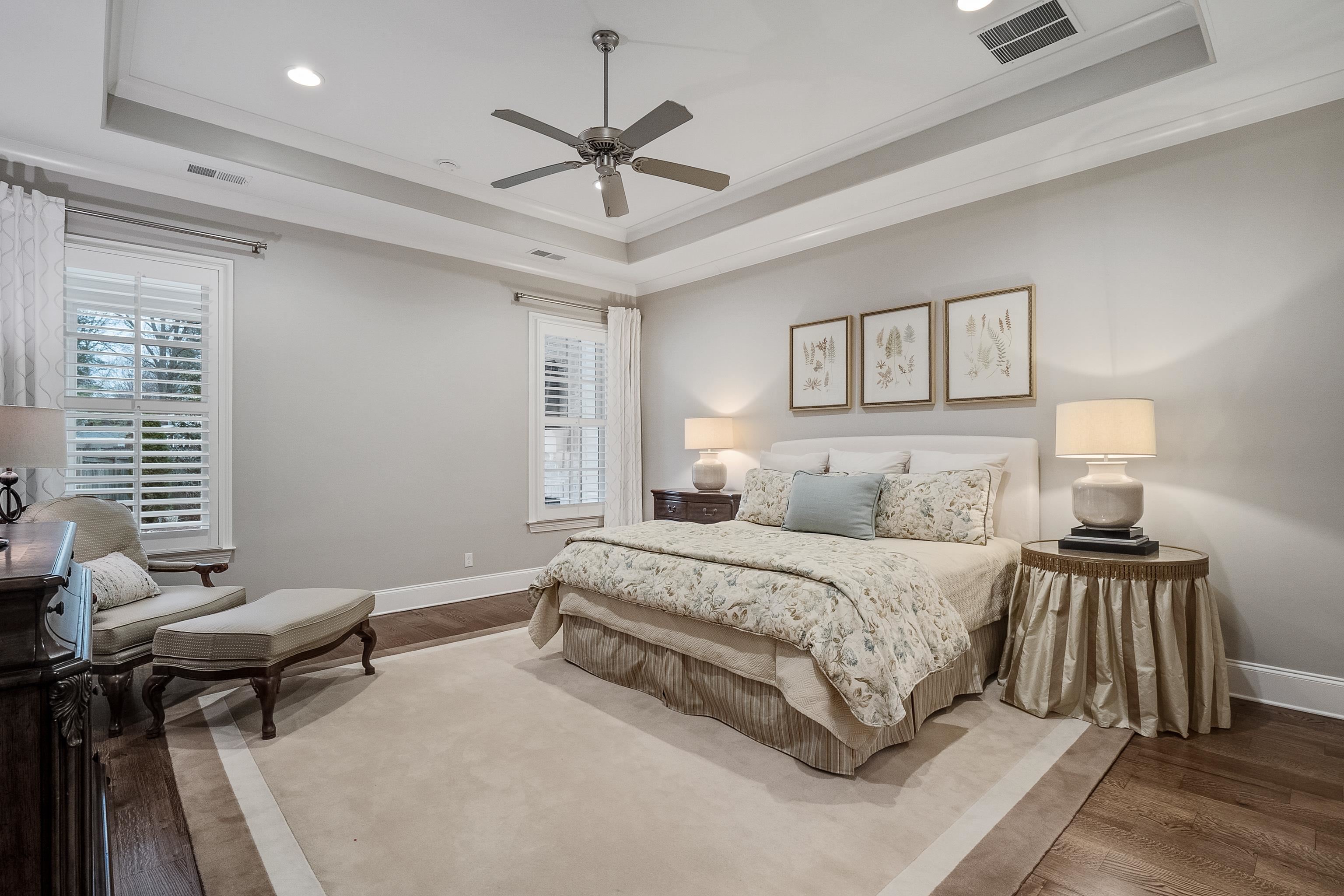 47 Addiegreen Cove Collierville, TN 38017 - Photo 12 of 34 a spacious bedroom with a bed and a chandelier