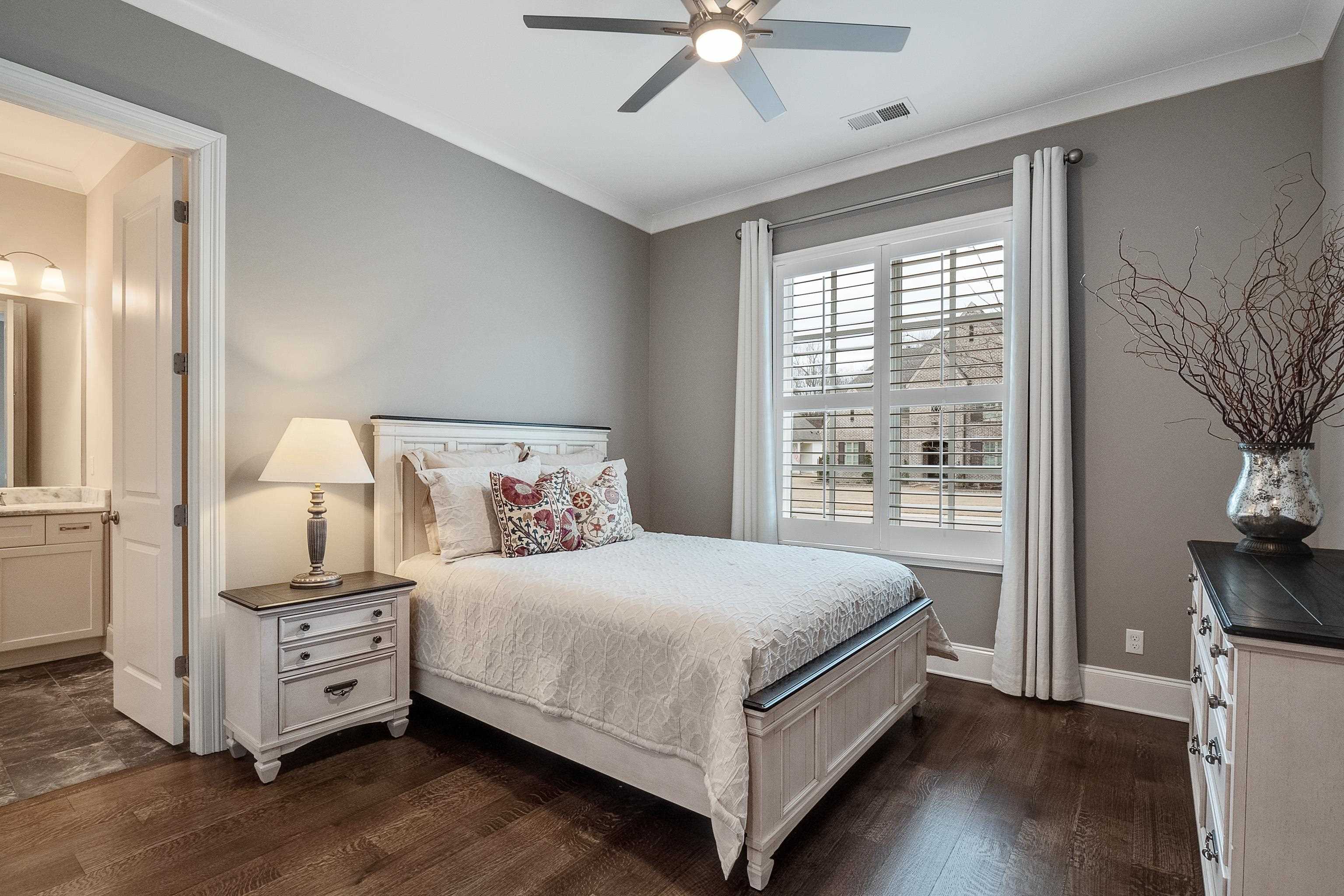 47 Addiegreen Cove Collierville, TN 38017 - Photo 15 of 34 a bedroom with a bed and a tv