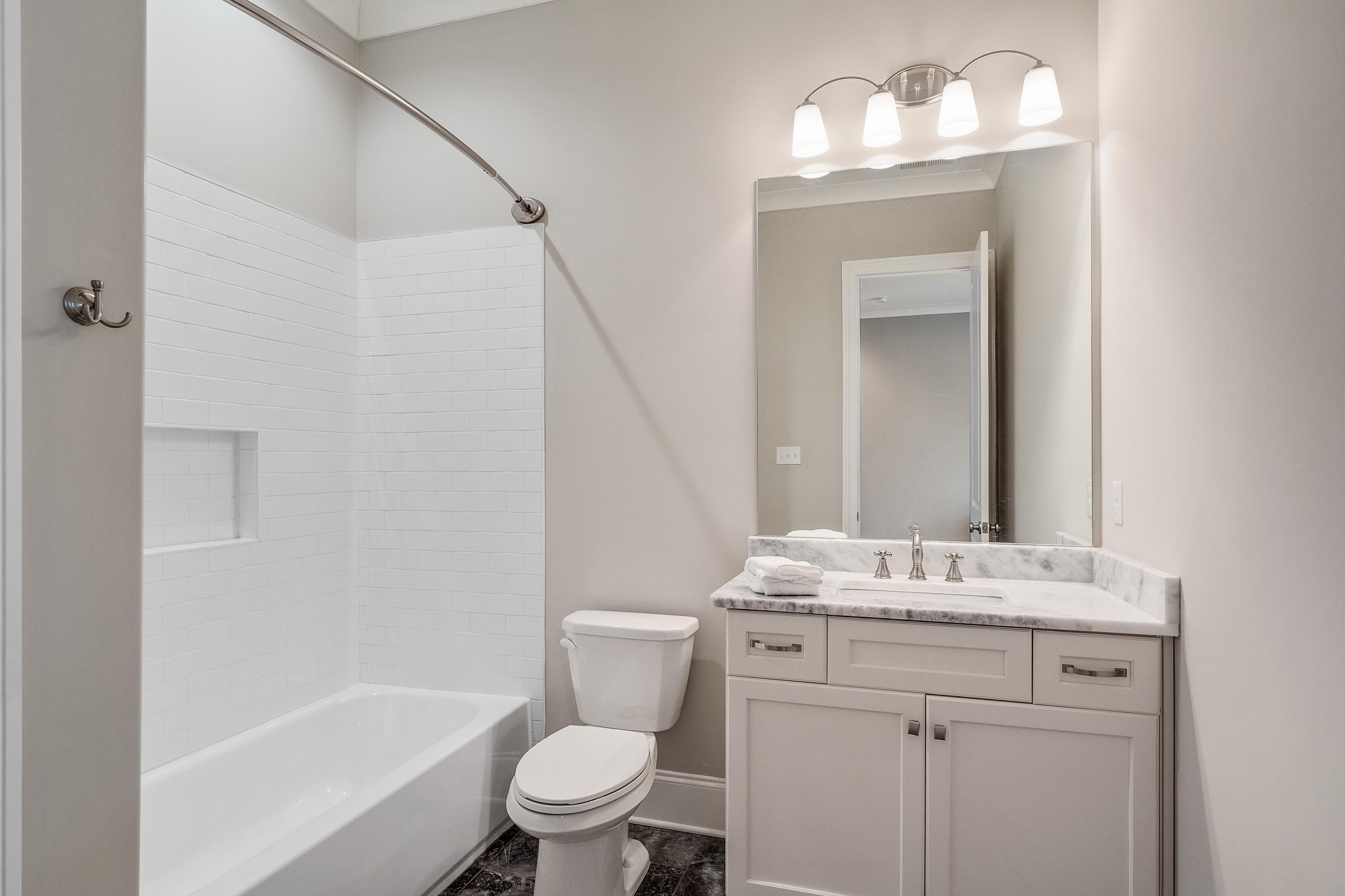 47 Addiegreen Cove Collierville, TN 38017 - Photo 16 of 34 a bathroom with a sink toilet and shower